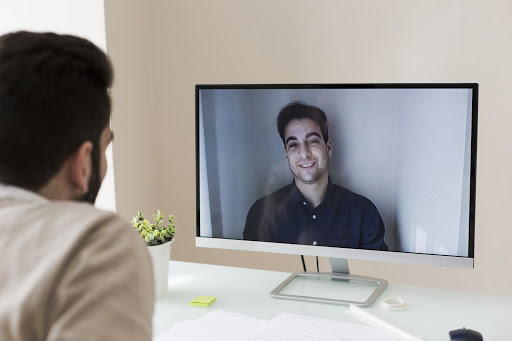 two persons video conferencing each other